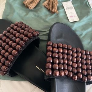 Brand new beaded Anthropologie sandals with storage bag!!